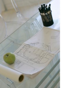 Architectural Design Drawing topped by a green apple