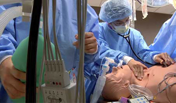 Medical Students Participating in Simulation with Dummy Patient