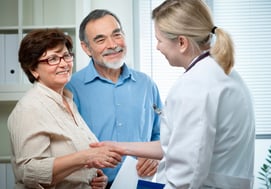 Family Shaking Doctor's hand